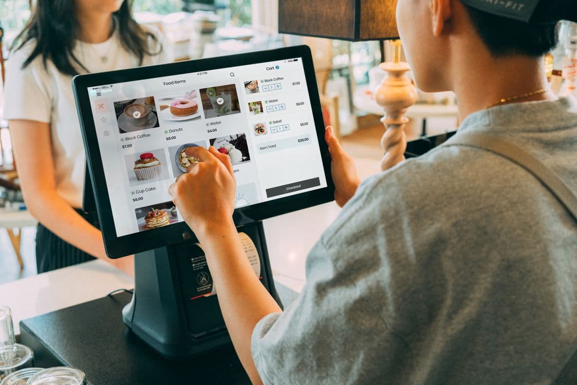 A point-of-sale terminal in use at a merchant counter
